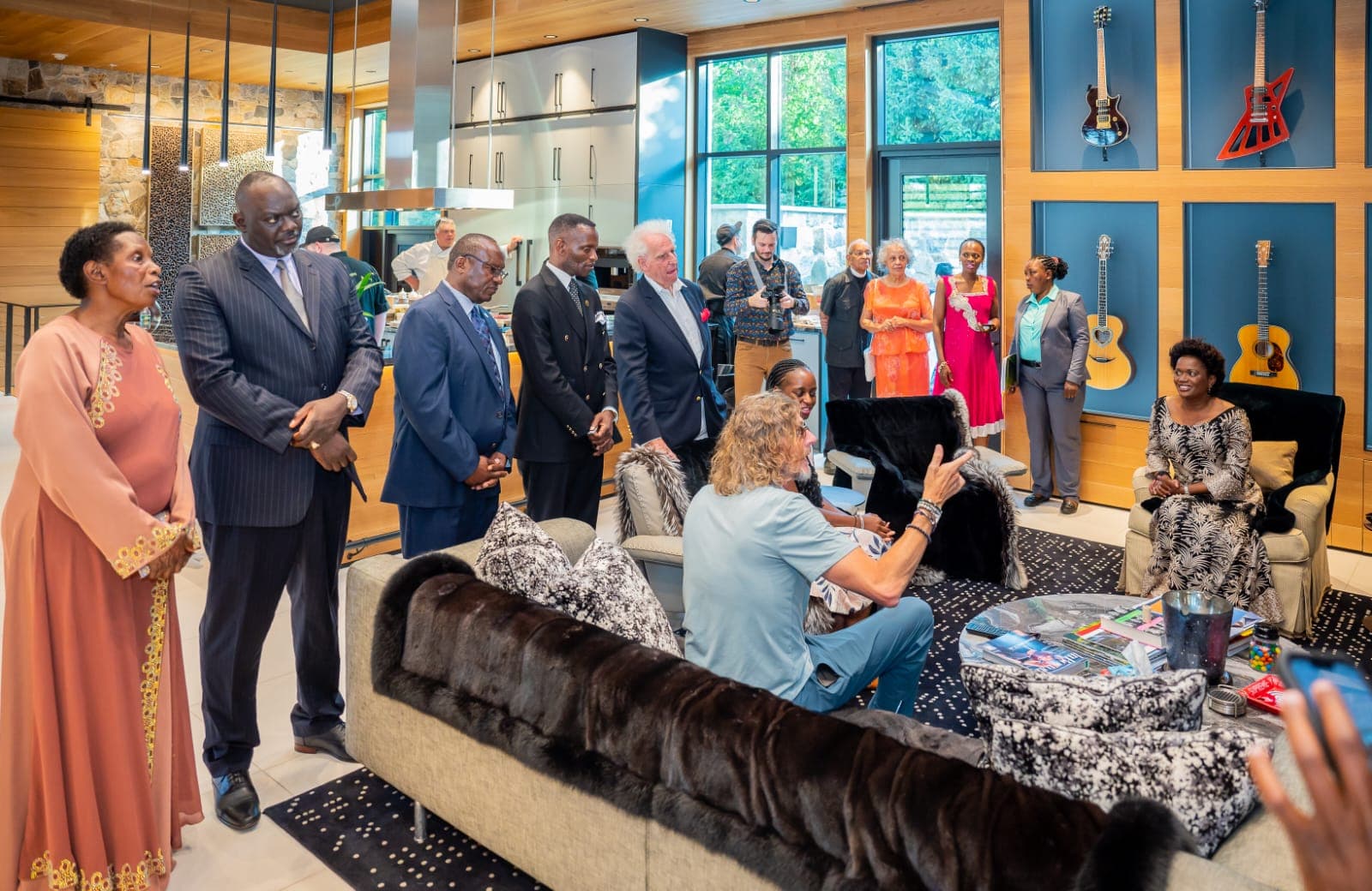 The visiting group seated together in conversation during the Boch Enterprises visit