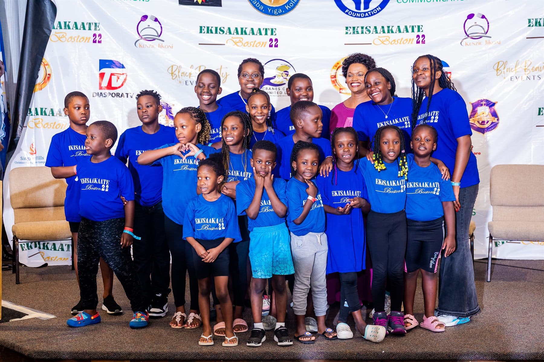 The blue team photographed together on stage