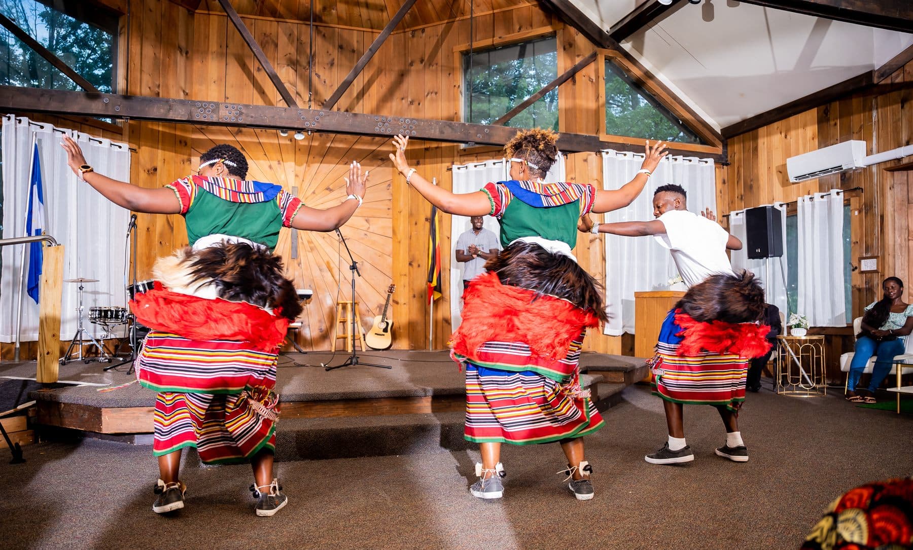 Young dancers in traditional Kiganda dress performing the baakisimba
