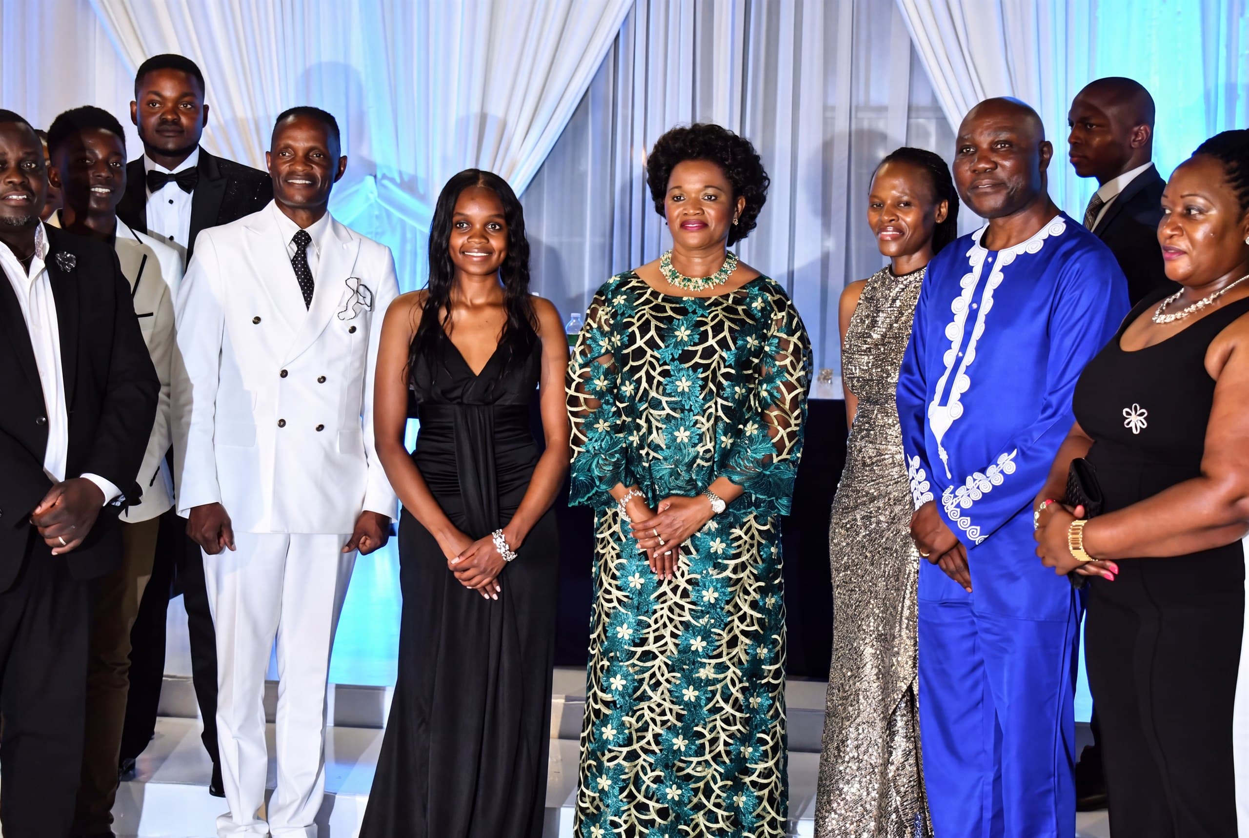 Her Royal Highness the Nnaabagereka standing with hosts and guests in evening wear at the gala