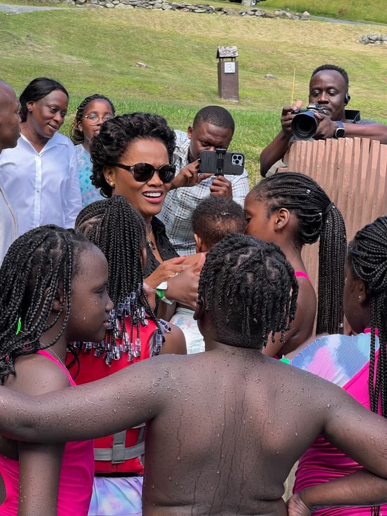 Her Royal Highness the Nnaabagereka laughing with happy campers after the water activities at Ekisaakaate Boston