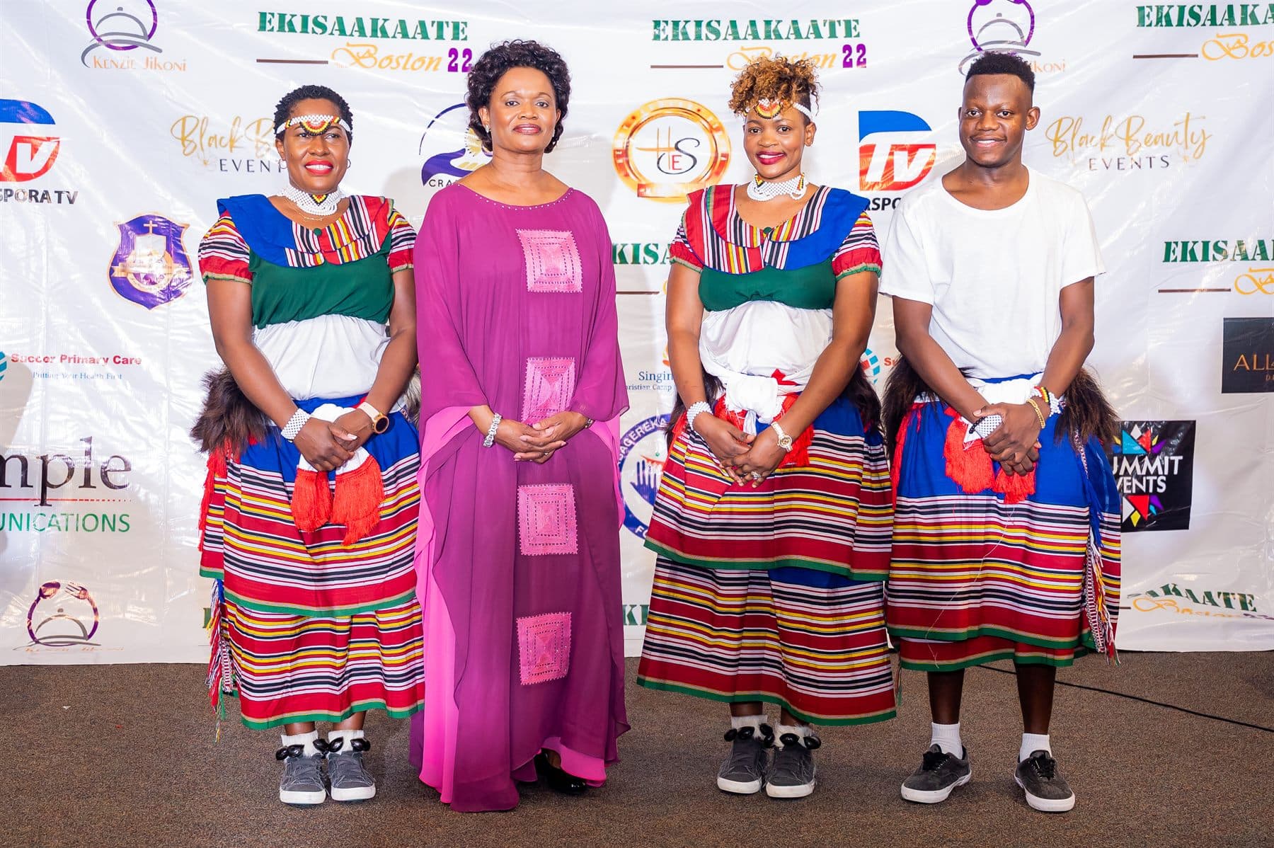 Her Royal Highness the Nnaabagereka standing with dancers in traditional dress