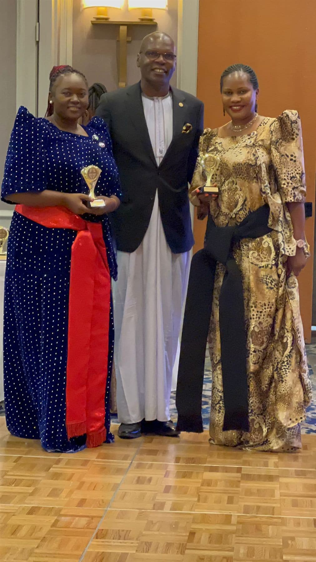 Parents and adult guests photographed together during the Ekisaakaate Boston closing ceremony