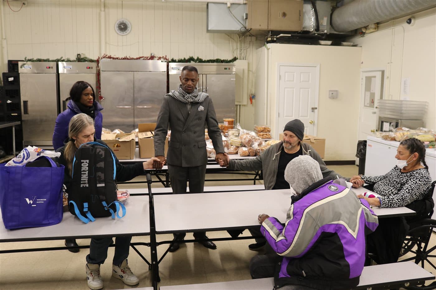Outreach leaders and community members gathered around tables