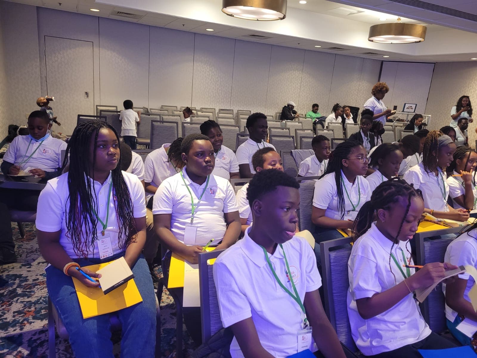 Young people listening and writing during mentorship