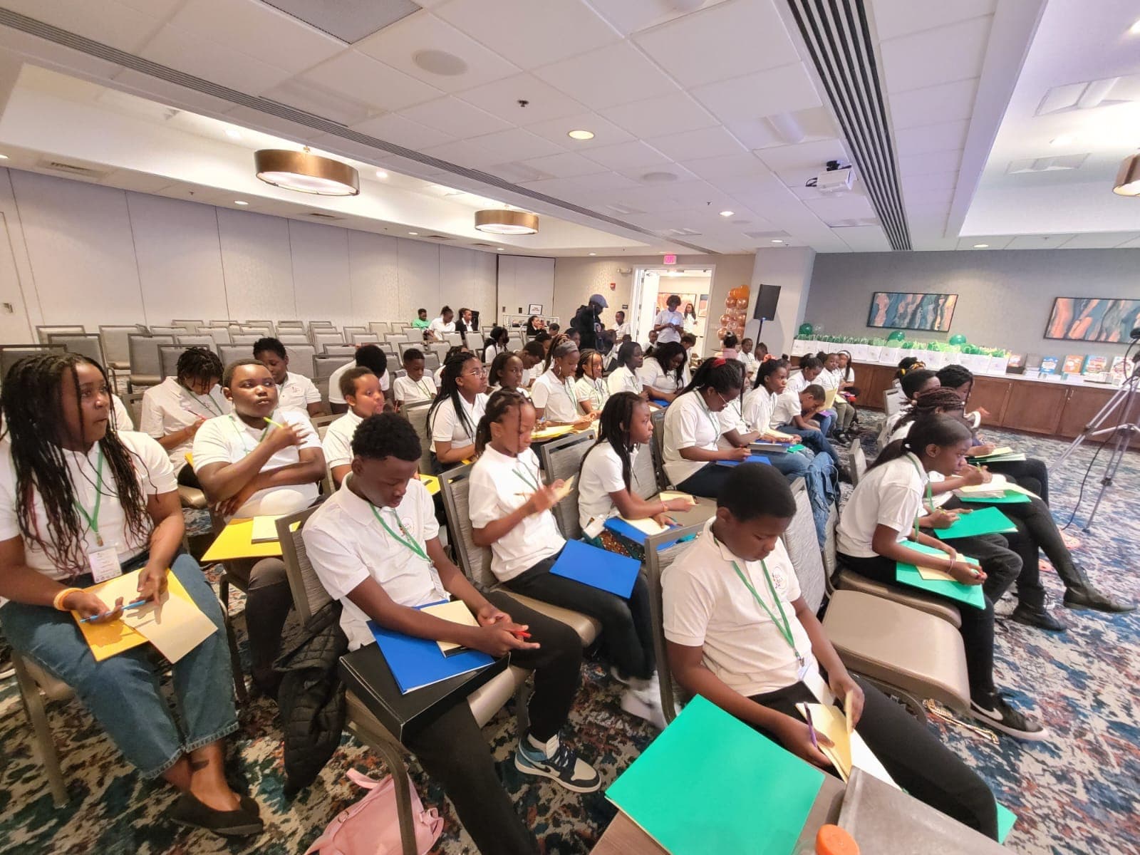 A room of young people participating in HESM mentorship